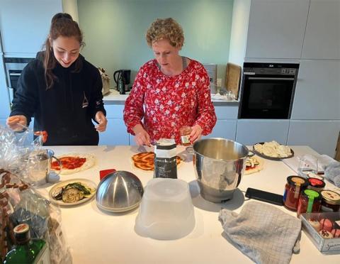 SYLE host and guest in kitchen preparing a meal